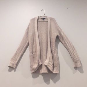 A tan colored knit cardigan from gap kids.